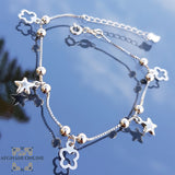 Silver four leaf clover with stars charms bracelet
