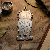 Solid silver Handala necklace pendant featuring traditional artisan geometric engravings on a minimal white background.
