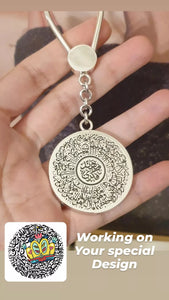 Silver car pendnt Al Falaq